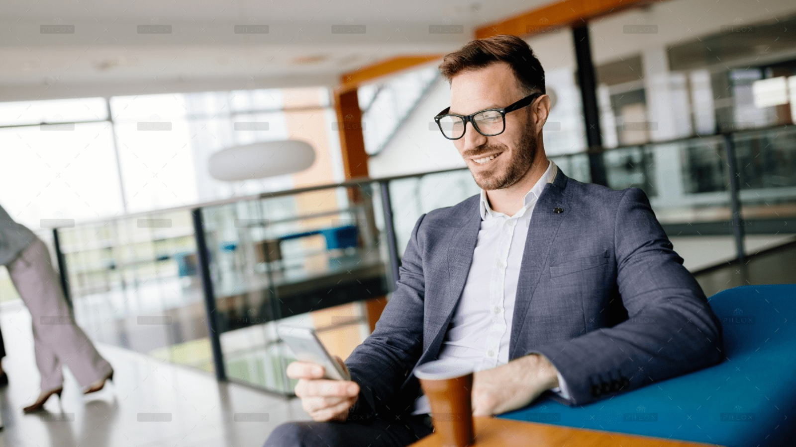 demo-attachment-1046-businessman-taking-a-break-with-a-cup-of-coffee-JW4B3DH